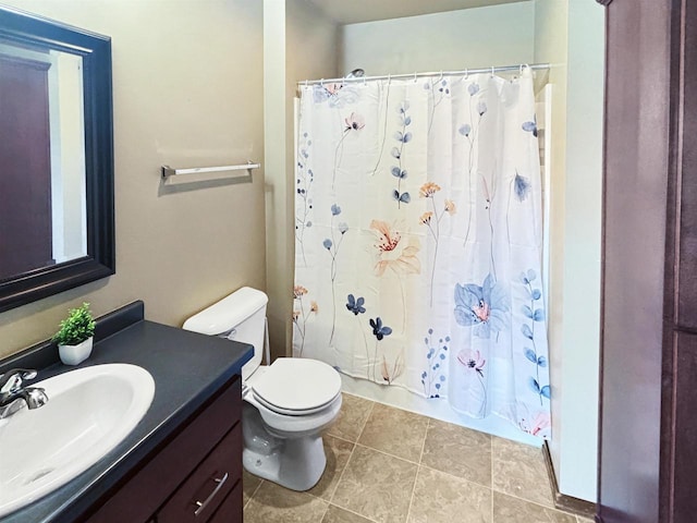 302 N Van Buren St, Green Bay, WI 54301 - bathroom featuring shower / tub combo with curtain, vanity, tile patterned floors, and toilet