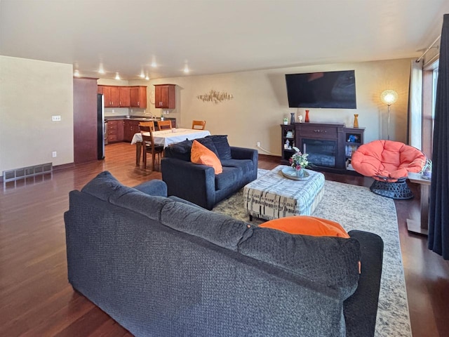 302 N Van Buren St, Green Bay, WI 54301 - living area with dark wood-type flooring and visible vents
