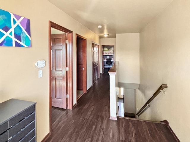 302 N Van Buren St, Green Bay, WI 54301 - hall with dark wood-type flooring, baseboards, and an upstairs landing