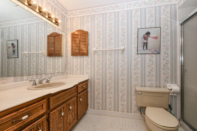 full bathroom featuring tile patterned floors, a shower with shower door, vanity, and toilet
