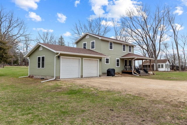 rear view of property with driveway, a porch, a lawn, roof with shingles, and a garage