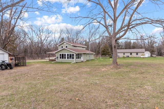 view of yard with an outdoor structure and fence
