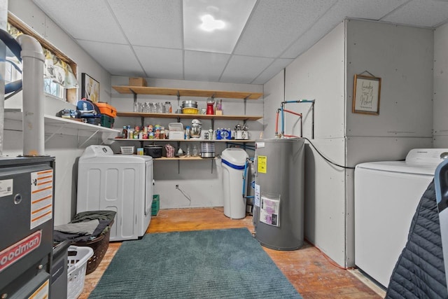 laundry area with separate washer and dryer, electric water heater, and laundry area