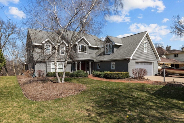 140 River Dr, Appleton, WI 54915 - view of front of home with an attached garage, driveway, a front lawn, and roof with shingles