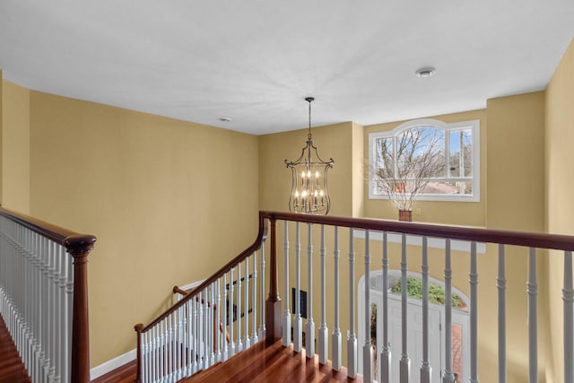 140 River Dr, Appleton, WI 54915 - staircase with an inviting chandelier and wood finished floors