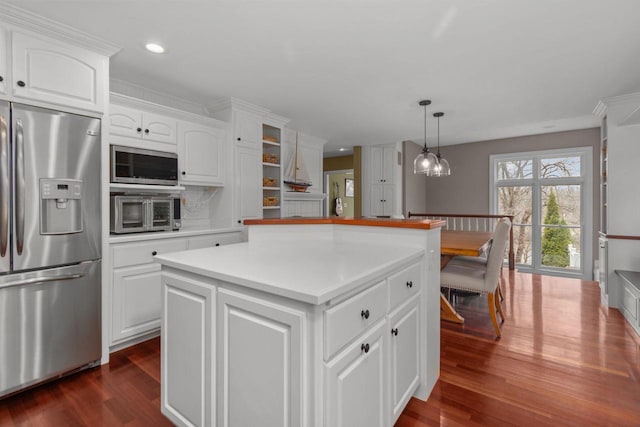140 River Dr, Appleton, WI 54915 - kitchen featuring stainless steel appliances, dark wood finished floors, white cabinetry, a kitchen island, and recessed lighting