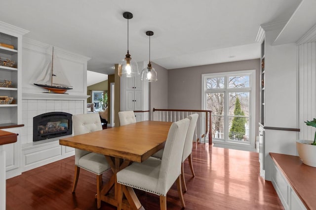 140 River Dr, Appleton, WI 54915 - dining room with dark wood-type flooring and a tile fireplace