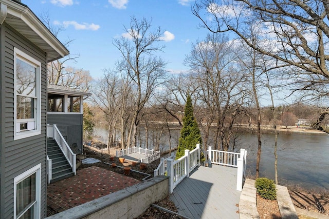 140 River Dr, Appleton, WI 54915 - exterior space with stairway, a sunroom, and a water view