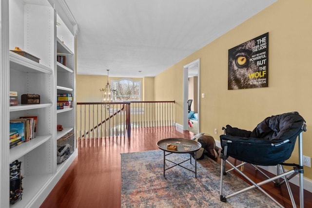 140 River Dr, Appleton, WI 54915 - living area featuring baseboards, wood finished floors, and a chandelier