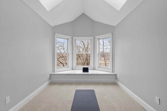 140 River Dr, Appleton, WI 54915 - interior space featuring baseboards, carpet flooring, and vaulted ceiling with skylight