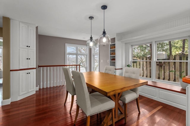140 River Dr, Appleton, WI 54915 - dining area featuring dark wood finished floors and a healthy amount of sunlight