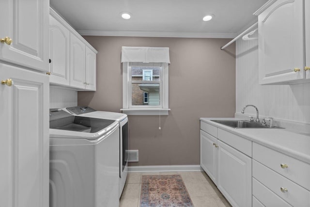 140 River Dr, Appleton, WI 54915 - clothes washing area with separate washer and dryer, cabinet space, crown molding, and a sink