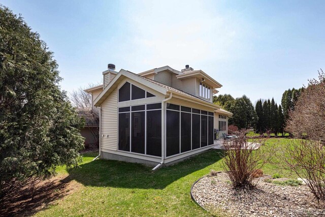 806 Stagecoach Trl, Madison, WI 53717 - back of property featuring a yard, a sunroom, and a chimney