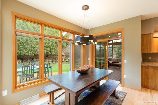 806 Stagecoach Trl, Madison, WI 53717 - dining space featuring baseboards, a notable chandelier, light wood finished floors, and visible vents