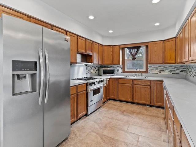 4155 Finch Ln, Delavan, WI 53115 - kitchen featuring brown cabinets, appliances with stainless steel finishes, and a sink