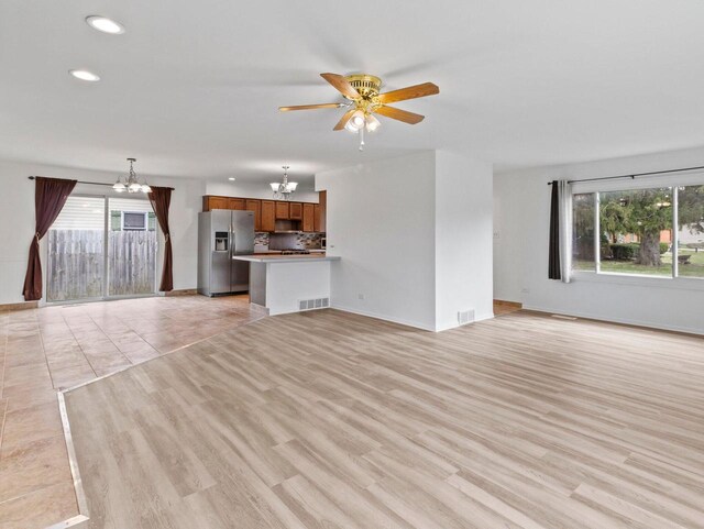 4155 Finch Ln, Delavan, WI 53115 - unfurnished living room featuring a wealth of natural light, visible vents, and recessed lighting