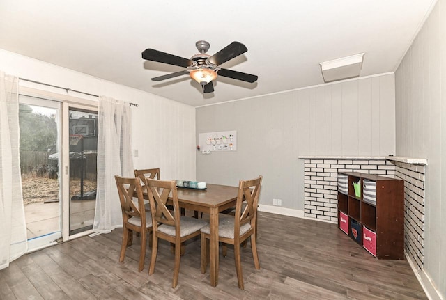 dining area featuring ceiling fan and dark wood-style flooring