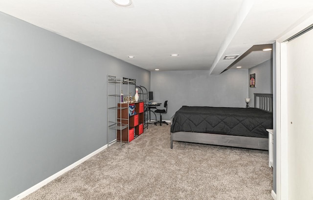 carpeted bedroom featuring recessed lighting, visible vents, and baseboards
