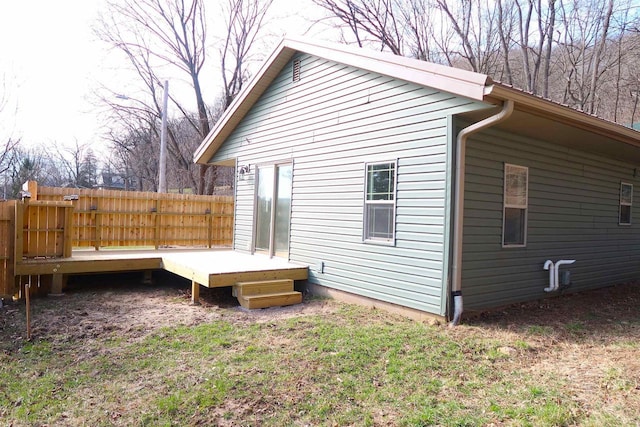 view of property exterior featuring a wooden deck