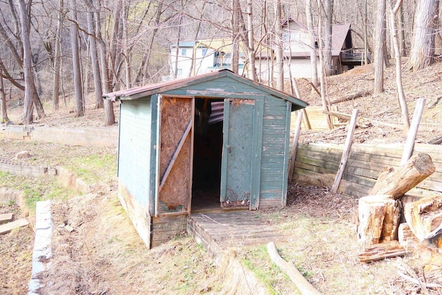 view of shed with fence