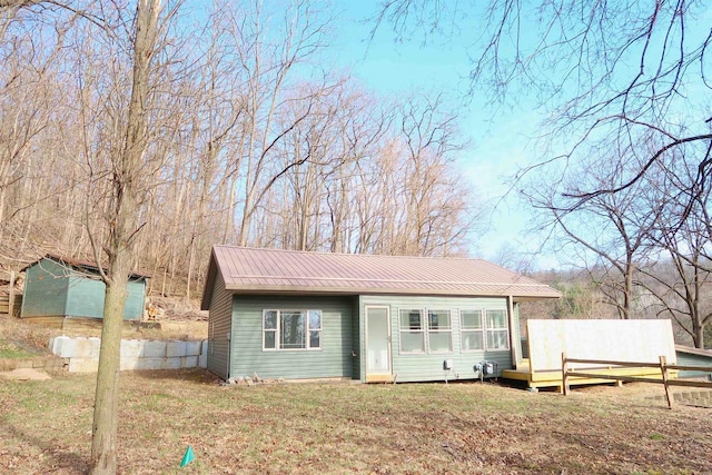 view of outbuilding featuring fence