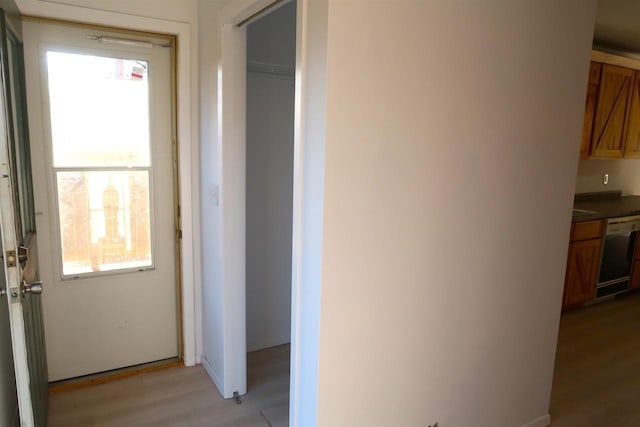 corridor with light wood-style floors
