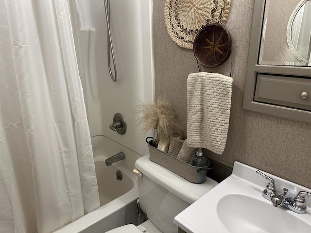 bathroom featuring vanity, shower / bathtub combination with curtain, and toilet