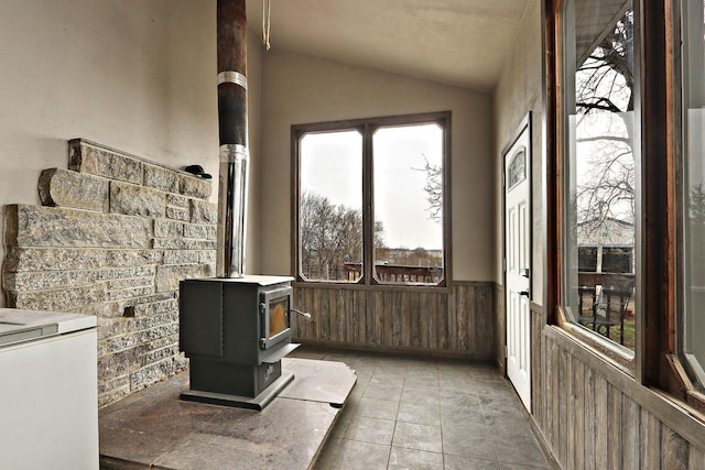 sunroom / solarium with a wood stove