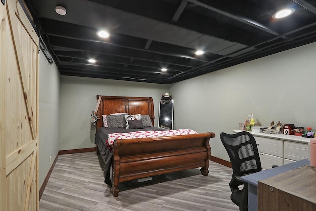bedroom featuring recessed lighting, light wood finished floors, and baseboards