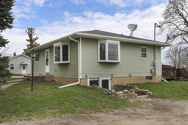 view of side of home featuring a yard