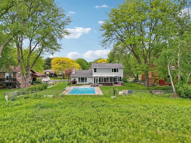 5407 Marsh Woods Dr, Mcfarland, WI 53558 - rear view of property with an outdoor pool, a chimney, and a patio area