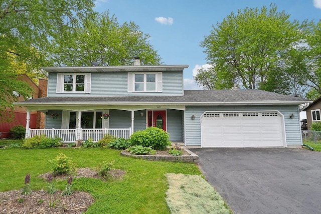 5407 Marsh Woods Dr, Mcfarland, WI 53558 - view of front of property with a chimney, an attached garage, driveway, covered porch, and a front yard