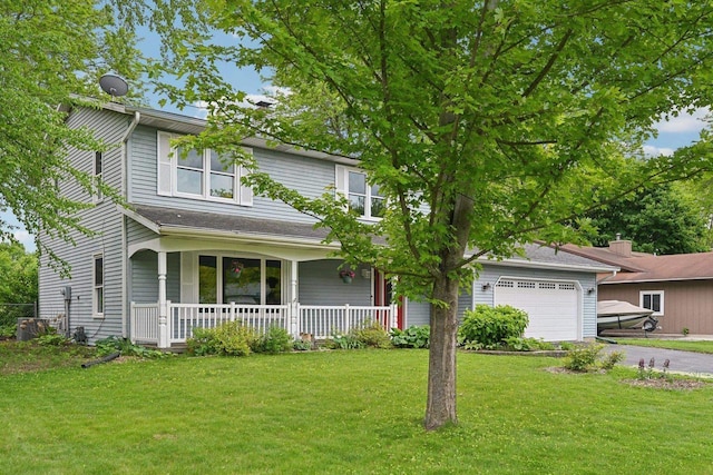 5407 Marsh Woods Dr, Mcfarland, WI 53558 - view of front of property with covered porch, driveway, a front lawn, and a garage