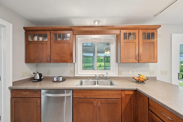 5407 Marsh Woods Dr, Mcfarland, WI 53558 - kitchen with dishwasher, a sink, glass insert cabinets, and brown cabinetry