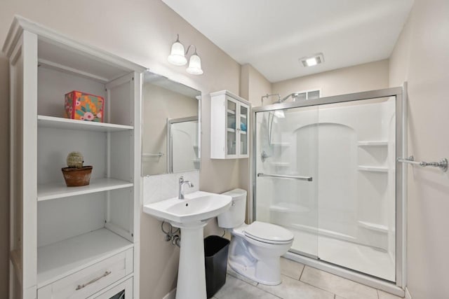 5407 Marsh Woods Dr, Mcfarland, WI 53558 - full bathroom featuring a stall shower, tile patterned flooring, and toilet
