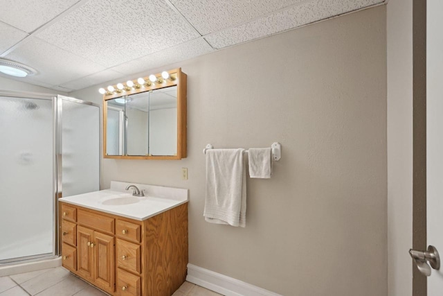 5407 Marsh Woods Dr, Mcfarland, WI 53558 - full bath with vanity, a stall shower, a drop ceiling, tile patterned floors, and baseboards