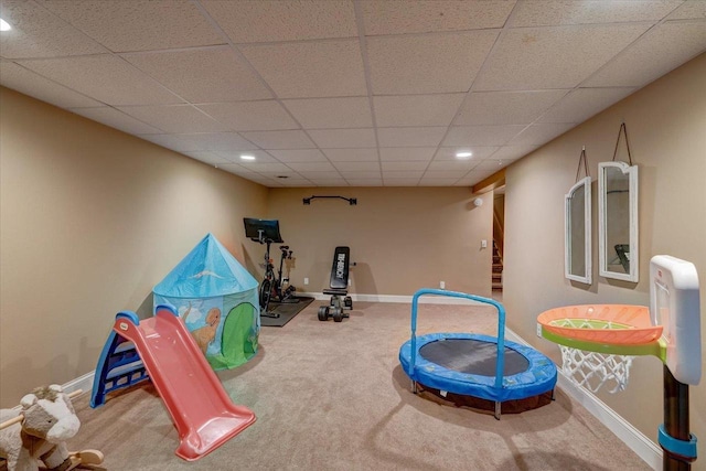 interior space featuring baseboards, a drop ceiling, recessed lighting, and carpet floors