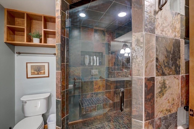 full bath with a shower stall and toilet