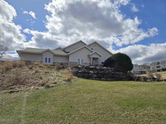 N2728 Paradise Rd, Lodi, WI 53555 - exterior space with a front lawn and stone siding