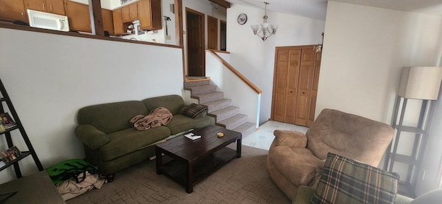 living area featuring stairway and vaulted ceiling