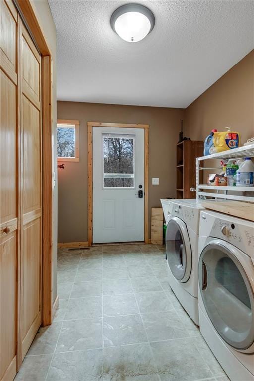 16187 Secluded Ln, Gordon, WI 54838 - washroom with baseboards, washer and clothes dryer, laundry area, and a textured ceiling