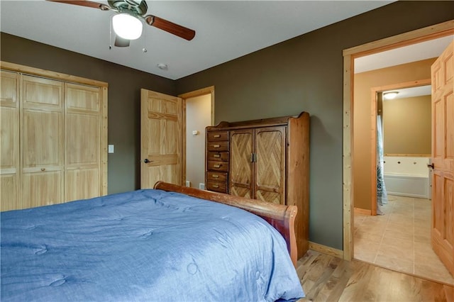 16187 Secluded Ln, Gordon, WI 54838 - bedroom with ceiling fan, baseboards, a closet, and light wood-type flooring
