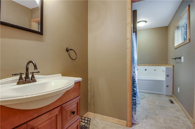16187 Secluded Ln, Gordon, WI 54838 - bathroom featuring a bath, vanity, and baseboards