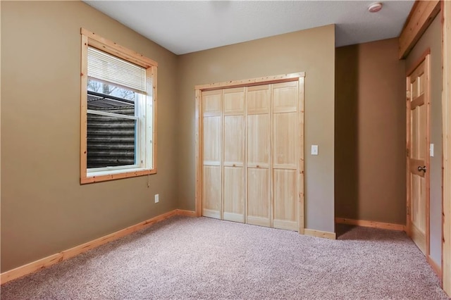 16187 Secluded Ln, Gordon, WI 54838 - unfurnished bedroom with baseboards, carpet flooring, and a closet