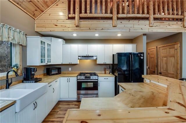 16187 Secluded Ln, Gordon, WI 54838 - kitchen featuring black appliances, light wood-type flooring, wood ceiling, light countertops, and under cabinet range hood