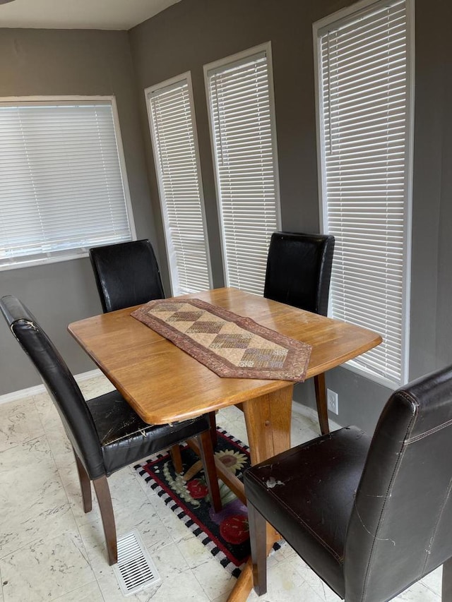 dining room featuring baseboards