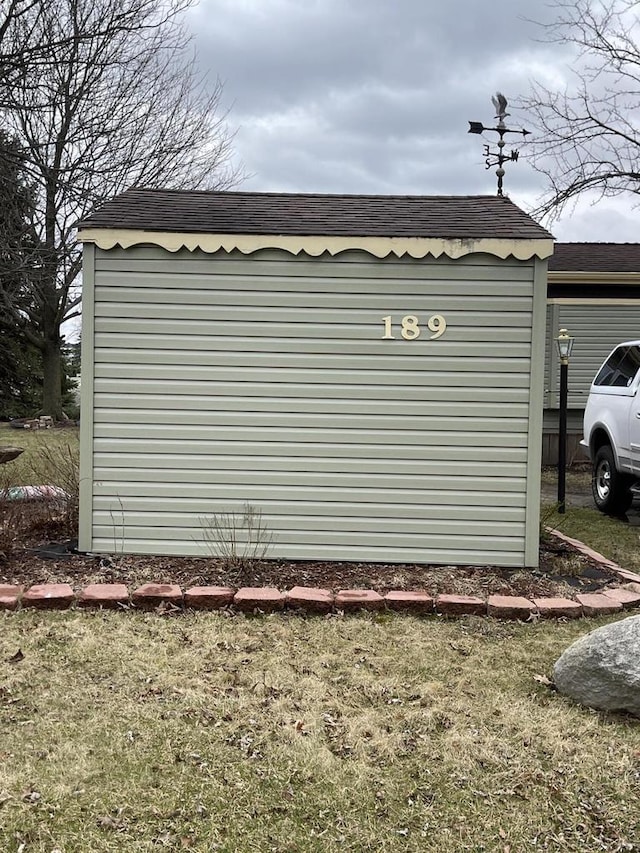 exterior space with a shingled roof