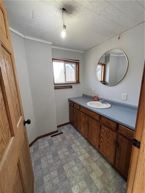 18196 200th St, Jim Falls, WI 54748 - bathroom with tile patterned floors, visible vents, baseboards, vanity, and ornamental molding