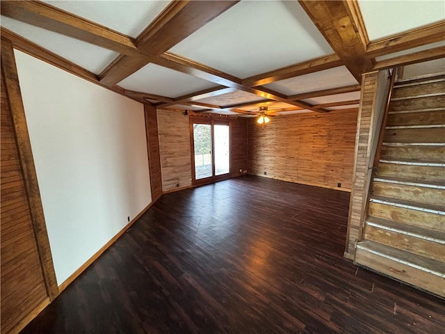 18196 200th St, Jim Falls, WI 54748 - unfurnished living room featuring coffered ceiling, a ceiling fan, beam ceiling, and wooden walls