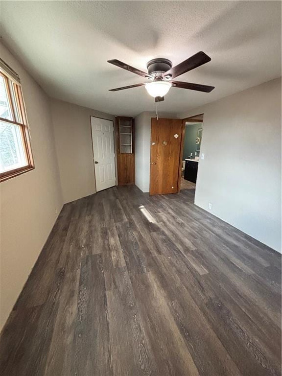 18196 200th St, Jim Falls, WI 54748 - interior space with a ceiling fan, dark wood-type flooring, and a textured ceiling